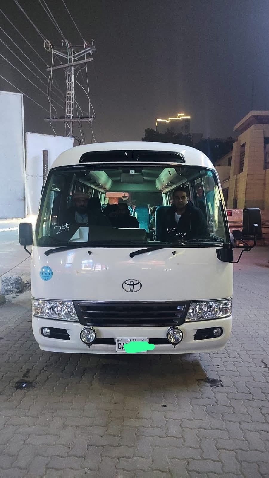 Toyota Coaster ready for night departure from Lahore