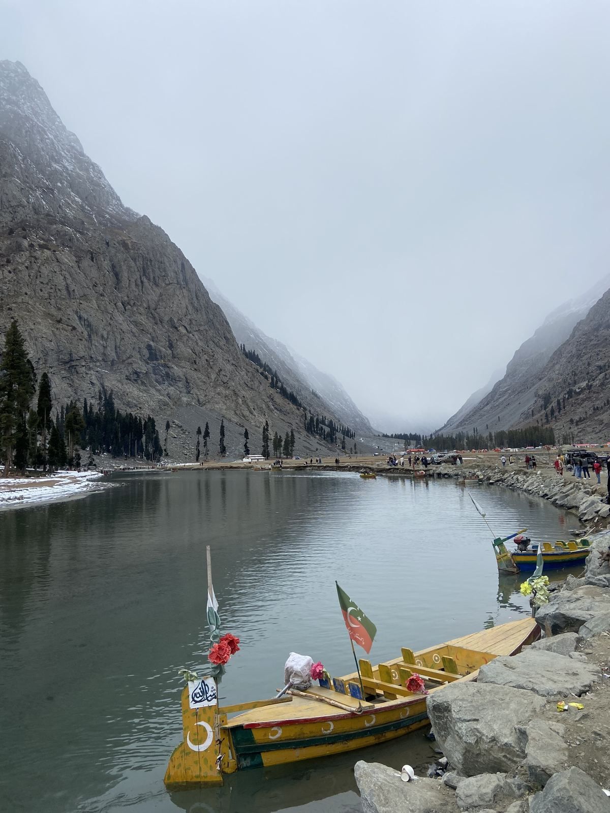 Wooden bridge over a glacial river in Kalam forest